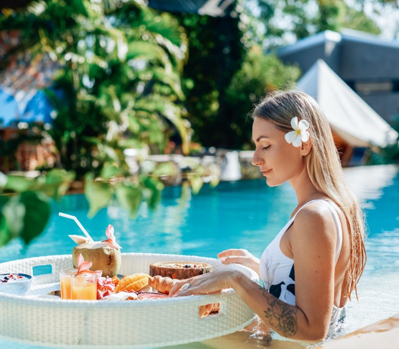 female-tourist-in-luxurious-hotel-enjoys-swimming-pool-and-tropical-food.jpg female-tourist-in-luxurious-hotel-enjoys-swimming-pool-and-tropical-food.jpg